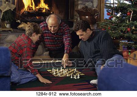 Stock Image - fire, people, chess, floor, fireplace, three. Fotosearch