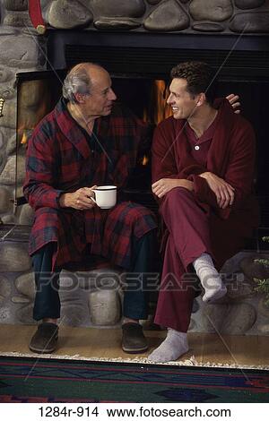Picture - fire, stone, Christmas, fireplace, family, father. Fotosearch