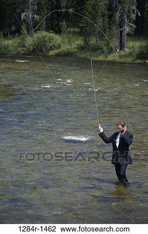 fish, wading, water, talking, phone, stream View Large Photo Image Stock Image - fish, wading, water, talking, phone, stream. Fotosearch