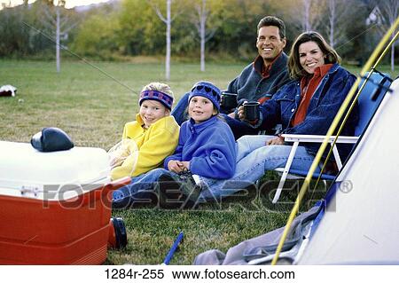 Stock Photography - grass, people, sitting, winter, outdoors, camping, chairs. Fotosearch