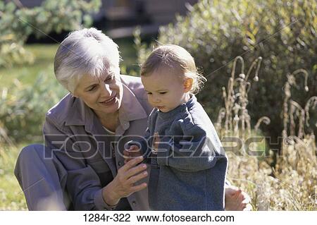 grass, people, walking, outdoors, family, beginnings, yard View Large Photo Image Stock Image - grass, people, walking, outdoors, family, beginnings, yard. Fotosearch