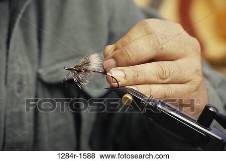 hand, holding, sports, fishing, hold, fly fishing View Large Photo Image Stock Photo - hand, holding, sports, fishing, hold, fly fishing. Fotosearch