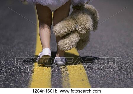 Stock Image - hanging, road, walking, stuffed animal, shoes, street. Fotosearch