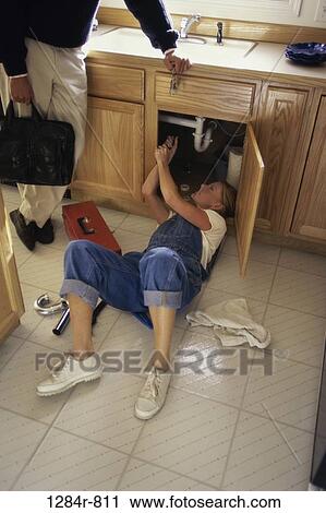 home, woman, pipes, repair, indoors, fixing View Large Photo Image Stock Image - home, woman, pipes, repair, indoors, fixing. Fotosearch
