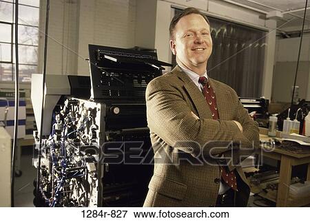Stock Photo - industry, confident, business, Middle-aged, machine. Fotosearch
