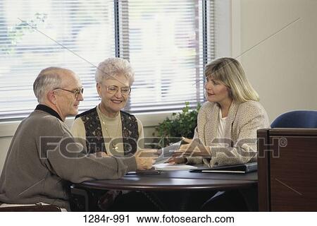 Stock Image - meeting, people, paper, consultation, couple, senior. Fotosearch