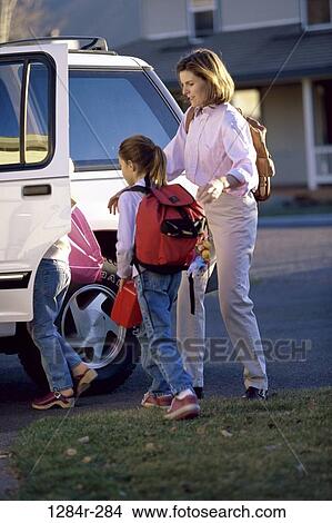 mother, car, transportation, outings, family, backpacks, daughters View Large Photo Image Picture - mother, car, transportation, outings, family, backpacks, daughters. Fotosearch