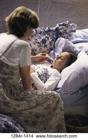 mother, thermometer, health, temperature, checking, daughter View Large Photo Image Picture - mother, thermometer, health, temperature, checking, daughter. Fotosearch
