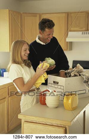 moving, couple, kitchen, new home, unpacking View Large Photo Image Stock Photo - moving, couple, kitchen, new home, unpacking. Fotosearch