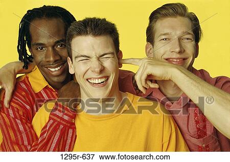 Stock Photo - multiethnic, men, people, playful, friends, mischievous, teasing. Fotosearch