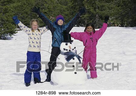 Stock Photo - multiethnic, people, snow, raised, winter, outdoors. Fotosearch