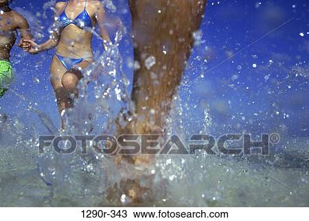 multiethnic, people, water, running, beach, splash View Large Photo Image Stock Image - multiethnic, people, water, running, beach, splash. Fotosearch
