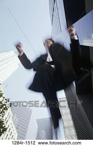 Stock Image - overhead, blur, jump, jumping, excitement, excited. Fotosearch