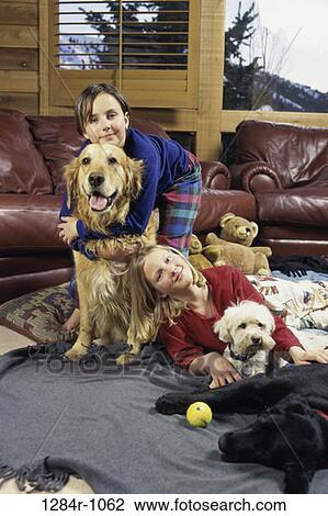 Stock Image - people, animals, pets, leather, hugging, friends, children. Fotosearch