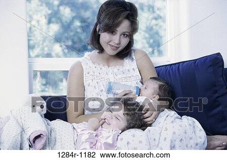 people, Asian, bottle, mother, family, feeding View Large Photo Image Stock Image - people, Asian, bottle, mother, family, feeding. Fotosearch