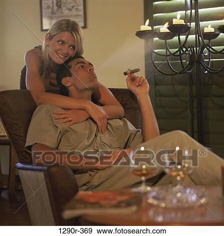 people, cigar, couple, smoking, indoors View Large Photo Image Stock Photo - people, cigar, couple, smoking, indoors. Fotosearch
