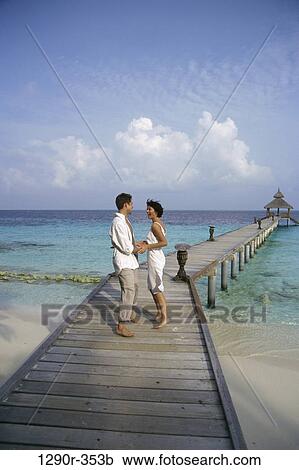 people, couple, beach, dock, clothed, pier View Large Photo Image Stock Image - people, couple, beach, dock, clothed, pier. Fotosearch