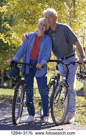 people, couple, senior, outdoors, exercise, bicycles, helmets View Large Photo Image Stock Image - people, couple, senior, outdoors, exercise, bicycles, helmets. Fotosearch