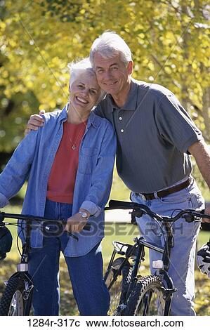 Stock Image - people, couple, senior, outdoors, exercise, bicycles, Caucasian. Fotosearch