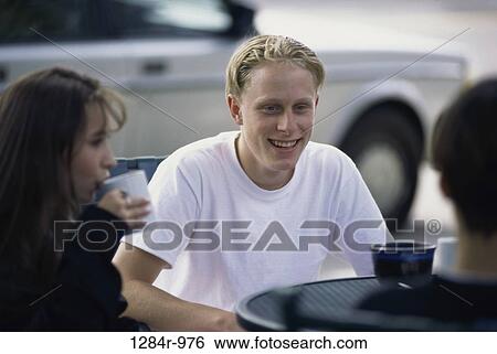 Stock Photograph - people, drinking, outdoors, friends, teens, drink. Fotosearch