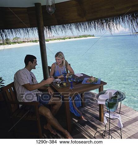 people, eating, couple, beach, deck View Large Photo Image Picture - people, eating, couple, beach, deck. Fotosearch