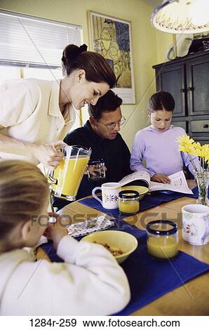 people, eating, glasses, table, window, orange, pouring View Large Photo Image Stock Photo - people, eating, glasses, table, window, orange, pouring. Fotosearch