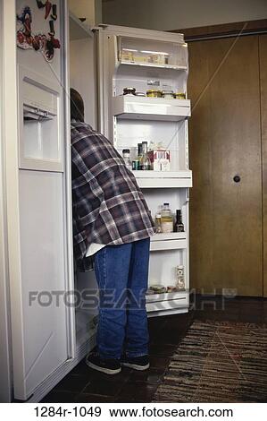 people, eating, refrigerator, boy, digging, plaid, denim View Large Photo Image Stock Photo - people, eating, refrigerator, boy, digging, plaid, denim. Fotosearch