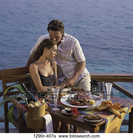 people, eating, water, couple, drinking, beach View Large Photo Image Stock Image - people, eating, water, couple, drinking, beach. Fotosearch