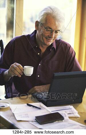 people, eyeglasses, senior, laptop, drinking, finance View Large Photo Image Stock Photography - people, eyeglasses, senior, laptop, drinking, finance. Fotosearch