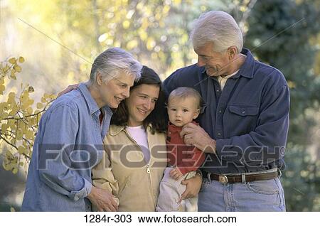 Stock Image - people, family, generations, father, grandparents, grandchild, grandson. Fotosearch