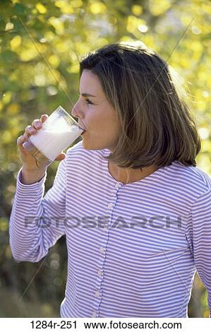 people, glass, woman, milk, drinking, outdoors, Middle-aged View Large Photo Image Stock Image - people, glass, woman, milk, drinking, outdoors, Middle-aged. Fotosearch