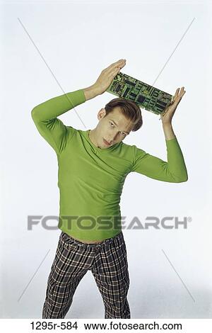 people, green, computer, holding, pants, plaid View Large Photo Image Picture - people, green, computer, holding, pants, plaid. Fotosearch
