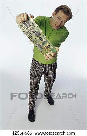 Stock Photography - people, green, computer, holding, pants, plaid. Fotosearch
