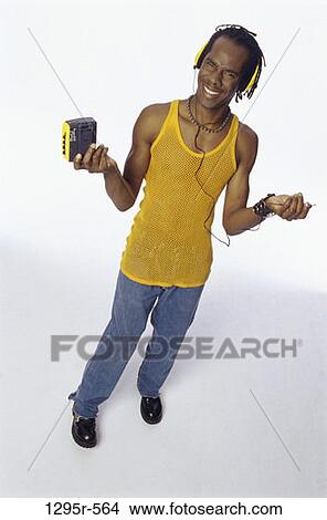 people, headset, indoors, African-American, personal music player, young adult View Large Photo Image Picture - people, headset, indoors, African-American, personal music player, young adult. Fotosearch