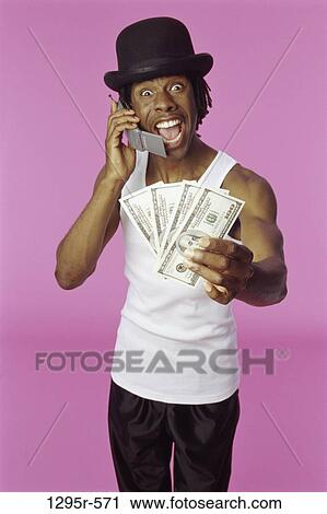 Stock Image - people, money, telephone, hat, excitement, joyous. Fotosearch