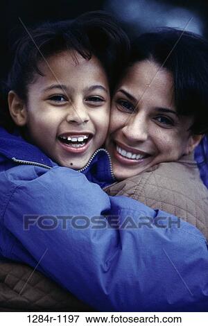 people, mother, Hispanic, outdoors, hugging, family, hug View Large Photo Image Stock Photo - people, mother, Hispanic, outdoors, hugging, family, hug. Fotosearch