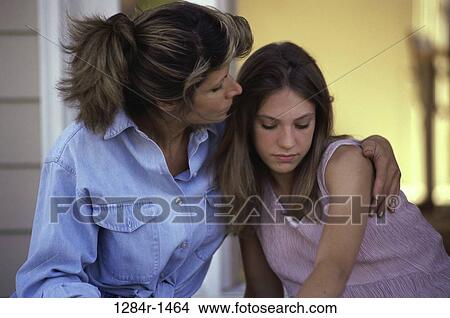 Picture - people, mother, outdoors, nurturing, family, sad. Fotosearch