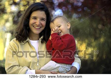 Stock Image - people, mother, outdoors, park, family, portrait, parent. Fotosearch