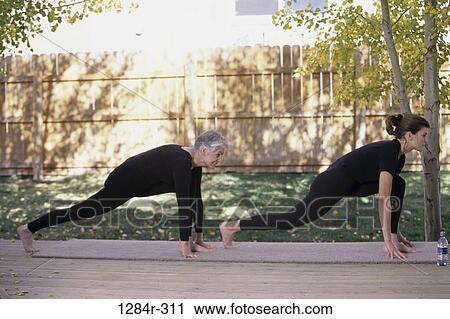 Stock Image - people, mother, stretching, outdoors, exercise, family, exercising. Fotosearch