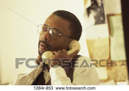 Stock Image - people, neck, telephone, eyeglasses, phone. Fotosearch