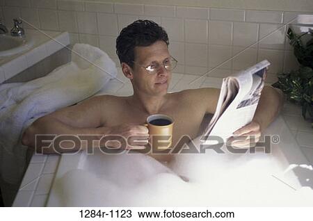 Stock Image - people, newspaper, eyeglasses, coffee, reading. Fotosearch