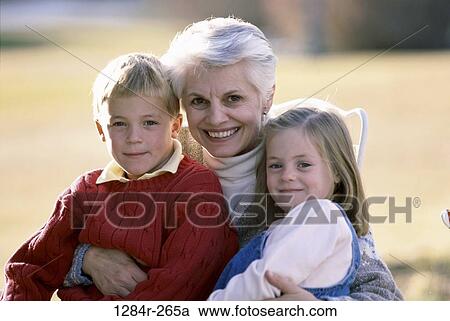 Stock Image - people, outdoors, hugging, family, hug, portrait, grandmother. Fotosearch