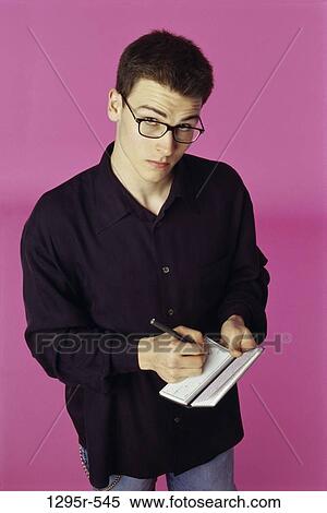 Stock Photography - people, pen, eyeglasses, writing, finance, personal finance. Fotosearch