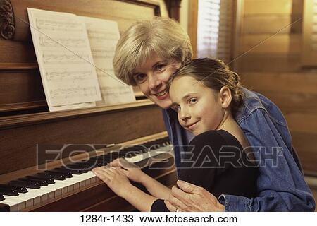 people, piano, family, portrait, grandchild, granddaughter View Large Photo Image Stock Image - people, piano, family, portrait, grandchild, granddaughter. Fotosearch