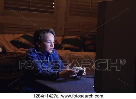 Stock Image - people, playing, boy, entertainment, television, child. Fotosearch