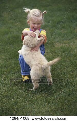 people, playing, dog, puppy, falling, pet, laughing View Large Photo Image Stock Photo - people, playing, dog, puppy, falling, pet, laughing. Fotosearch