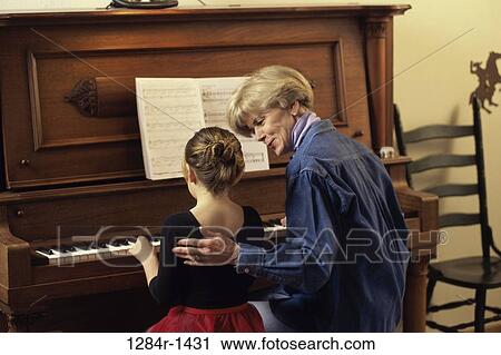 Stock Image - people, playing, music, piano, family, play. Fotosearch