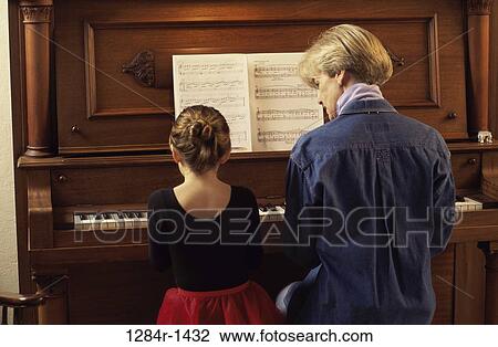 people, playing, music, piano, family, play View Large Photo Image Stock Image - people, playing, music, piano, family, play. Fotosearch