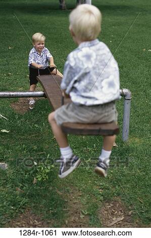 people, playing, seesaw, playground, outdoors, children, blond View Large Photo Image Stock Image - people, playing, seesaw, playground, outdoors, children, blond. Fotosearch