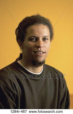 Stock Photo - people, portrait, indoors, African-American, young adult, Young men headshots. Fotosearch